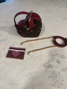 Heart Crossbody
In Signature Canvas Heart Petal Print with Coach heart wallet
